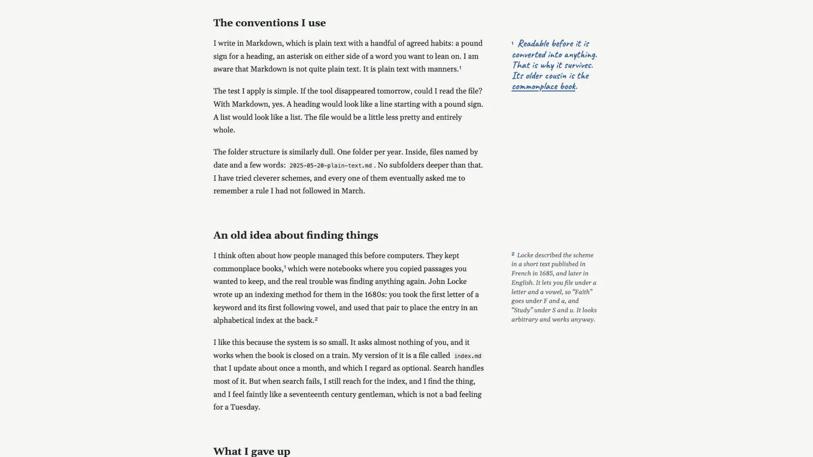 An essay under two headings with footnote numbers in the text; in the margin beside them, note 1 in blue handwriting and note 2, a longer one, in small italic print.